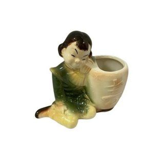 Royal Copley Girl Leaning On Planter Holding Fan Sleeping Green Dress Trousers